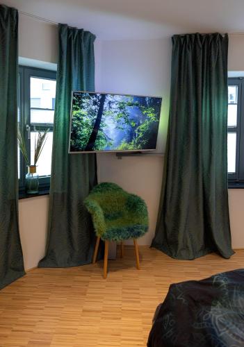 Televisyen dan/atau pusat hiburan di Lichtdurchflutetes Design - Appartement Gütersloh - 90 qm