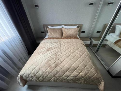 Ein Bett oder Betten in einem Zimmer der Unterkunft VEL ЛЮКС