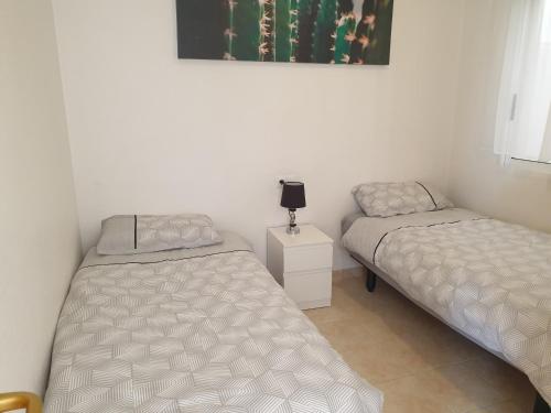 Postel nebo postele na pokoji v ubytování Sunlight Apartment - Molino Blanco - La Zenia