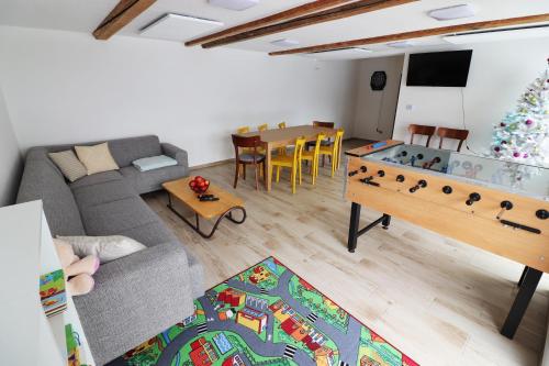 a living room with a couch and a table at Chata Matzo in Mýto pod Ďumbierom