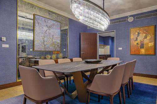 a dining room with a large table and chairs at InterContinental Warszawa by IHG in Warsaw