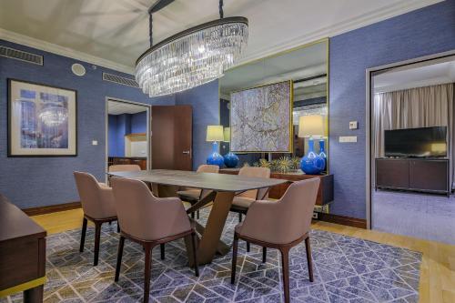 a dining room with a table and chairs at InterContinental Warszawa by IHG in Warsaw