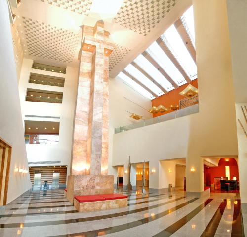 a view of the lobby of a building with a cross at Camino Real Monterrey in Monterrey