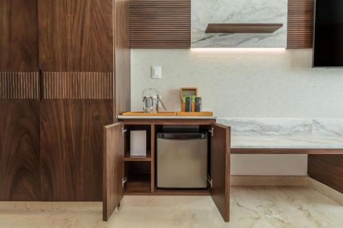 a kitchen with a counter with a sink at Camino Real Mérida in Mérida