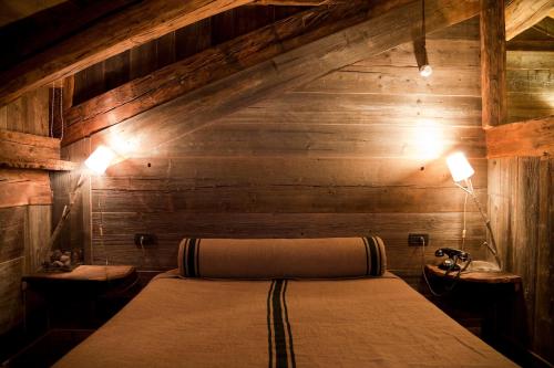 Katil atau katil-katil dalam bilik di Chalet Svizzero Apartments