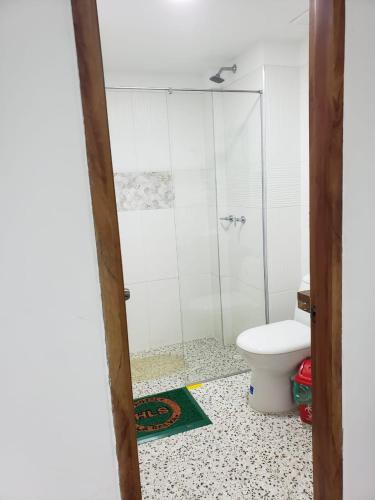 a bathroom with a shower and a toilet at HOTEL LA SELVA JARDIN in Jardin