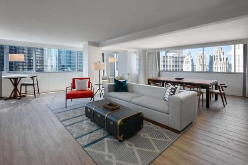 a living room with a couch and a table at The Royal Sonesta Chicago Downtown in Chicago