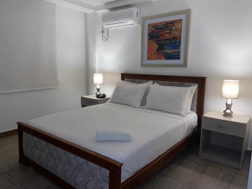 Postel nebo postele na pokoji v ubytování Hostal Manakin