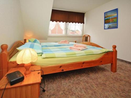 Säng eller sängar i ett rum på Apartments, Mirow