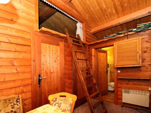 a room with a ladder in a log cabin at Blockhaus Spreewald, Alt Zauche in Alt Zauche
