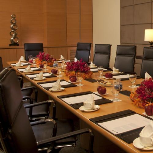 a large conference room with a long table with chairs at Radisson Blu Hotel, Nagpur in Nagpur