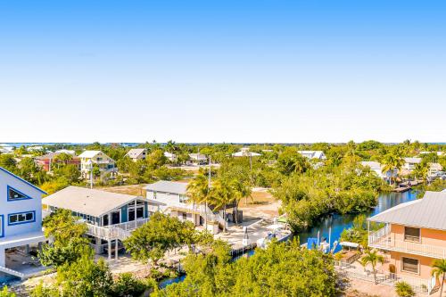 an aerial view of a town with a river and houses at Tradewinds Treat in Big Pine Key