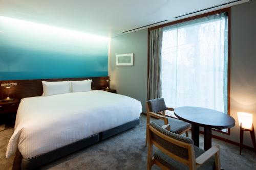 HOTEL AO KAMAKURA tesisinde bir odada yatak veya yataklar
