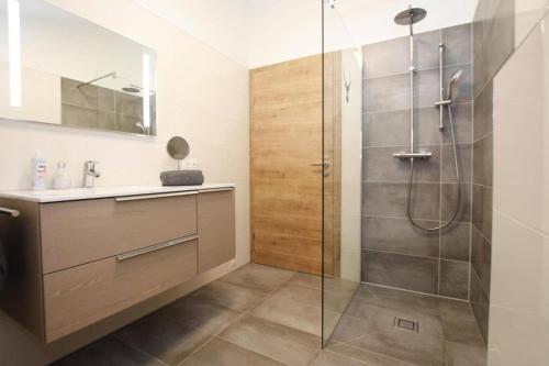 a bathroom with a shower and a sink at Chalet Charivari Inzell, Inzell in Inzell