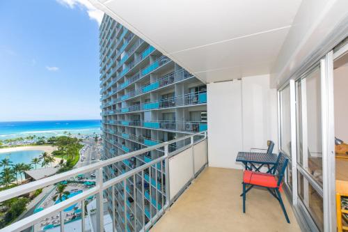 a balcony with a view of the ocean at Ilikai Tower 1314 Lagoon View 1BR in Honolulu