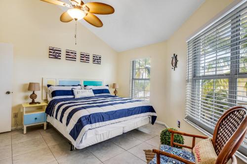 a bedroom with a bed and a ceiling fan at The Anchor House in Marathon