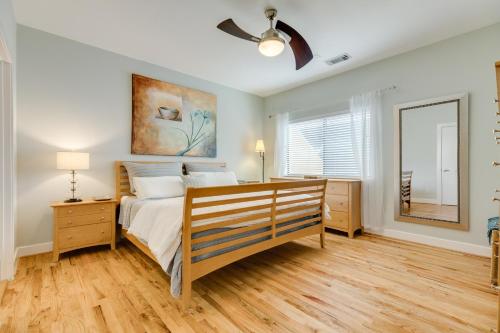 a bedroom with a bed and a ceiling fan at Unwind in Houston in Houston