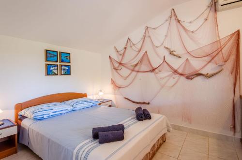 En eller flere senge i et værelse på Apartments Namoru Gradina