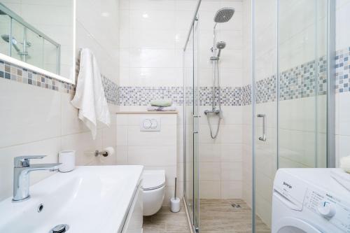 a bathroom with a shower and a toilet and a sink at House Davor in Slano