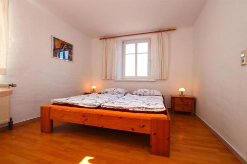 a bedroom with a bed with two candles on it at Flat in Klocksin with a garden in Klocksin