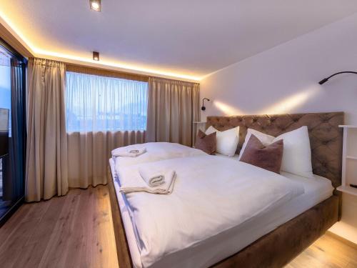 Postel nebo postele na pokoji v ubytování Apartments B-HOME, Bramberg am Wildkogel