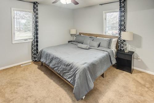 a bedroom with a bed and two windows at Belleville Beauty - Luxury Stay for Work or stay for Play either way this is the perfect property for you! residence in Belleville