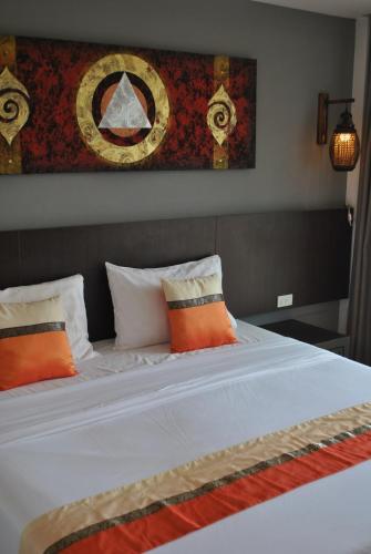 Ліжко або ліжка в номері Baan Kata Maytha