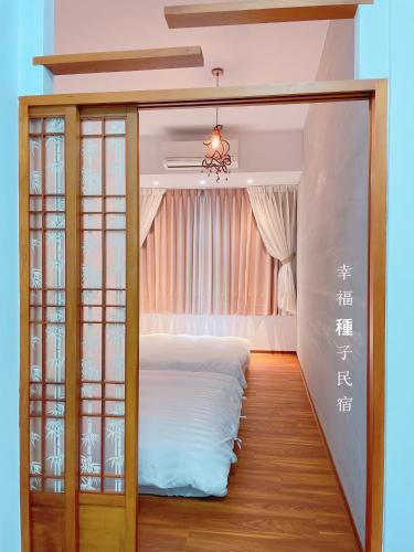 Una cama o camas en una habitación de Sweet House