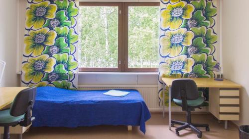 Tempat tidur dalam kamar di Summer Hotel Tähtelä, Alkio-opisto