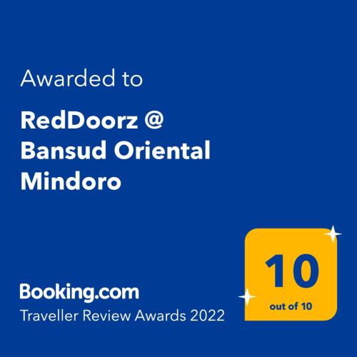 a yellow sign with the words awarded to red doctorsawn original minotaur at RedDoorz @ Bansud Oriental Mindoro in Bansud