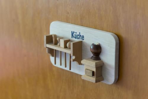 a switch on a wall with a nut on it at Jewel Duplex in Fieschertal