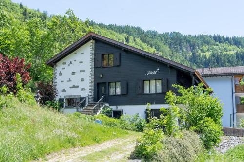 a house on the side of a hill at Jewel Duplex in Fieschertal