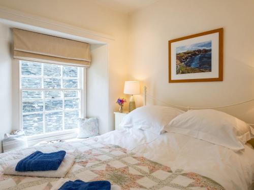 Voodi või voodid majutusasutuse Cobble Cottage toas