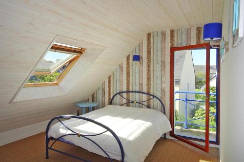 En eller flere senge i et værelse på Holiday home, Pléneuf-Val-André