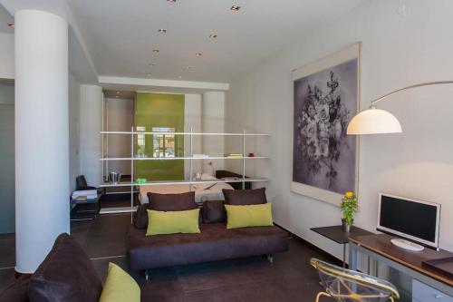 TV a/nebo společenská místnost v ubytování Faro Apartments