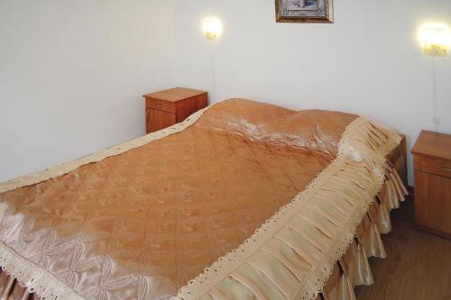 a bed in a room with two nightstands and a bed sidx sidx sidx at holiday home, Kolczewo in Kołczewo