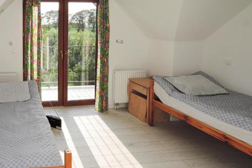 Ένα ή περισσότερα κρεβάτια σε δωμάτιο στο Holiday home in Darzowice by Wolin for 8 persons