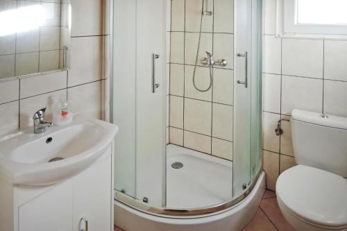 a bathroom with a shower and a sink and a toilet at Holiday resort, Rewal in Rewal