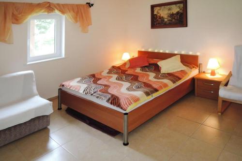 מיטה או מיטות בחדר ב-holiday home, Kolczewo