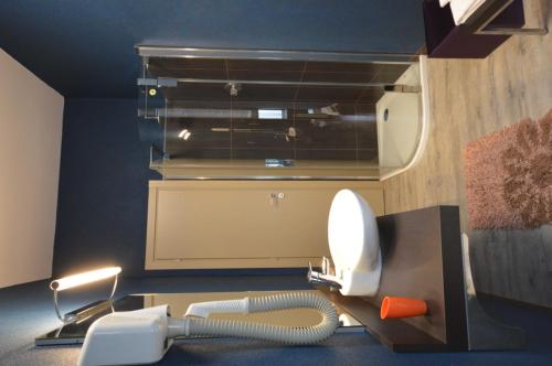 a room with a hair dryer and a phone at Residence Star in Turin