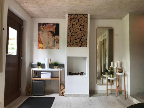 a room with a mirror and a table with a desk at Almhaus Teichalm/Sommeralm in Breitenau