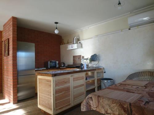 a kitchen with a counter and a refrigerator in it at Minimax in Odesa