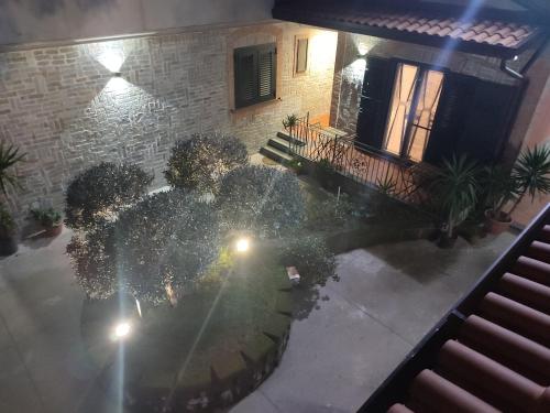 an aerial view of a garden at night at Midway House Italy Apartment in Sant'Egidio del Monte Albino