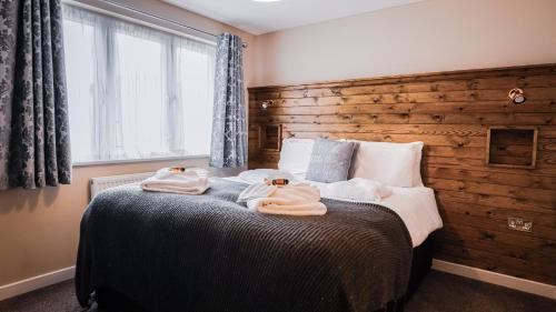 Llit o llits en una habitació de Warrenwood Country Park