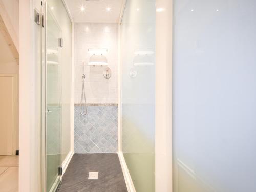 a shower with a glass door in a bathroom at Medusa Apartment - Dépendance in Finale Ligure