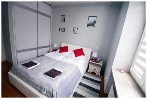 Łóżko lub łóżka w pokoju w obiekcie Color 24 Apartament IV