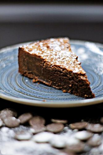 a piece of chocolate cake on a blue plate at Best Western Marseille Aeroport in Vitrolles
