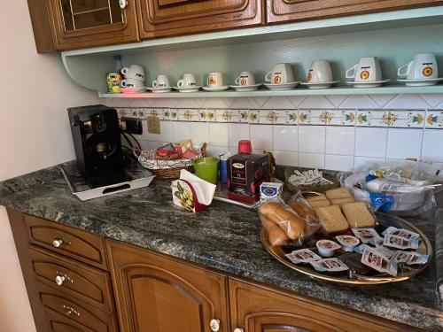 a kitchen counter with a plate of food on it at B&B VILLA BELLA in Catanzaro
