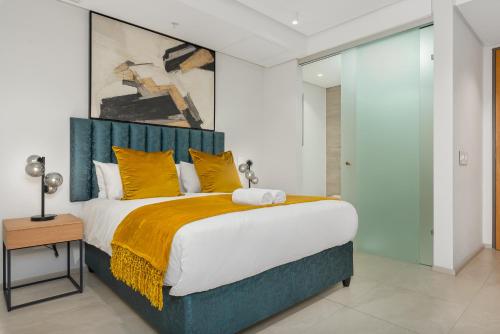 Krevet ili kreveti u jedinici u objektu 117 on Strand Luxury Apartments