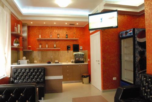 
A kitchen or kitchenette at Hotel Relax City Center
